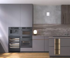 当代深灰色无手厨房，墙上有Blauberg Vento单间热回收通风单元的白色小面板